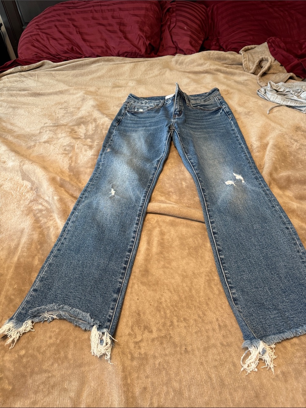Women’s Blue Flare Jeans with Distressed Hem